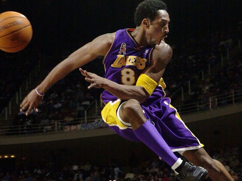 Kobe Bryant jumps over fans