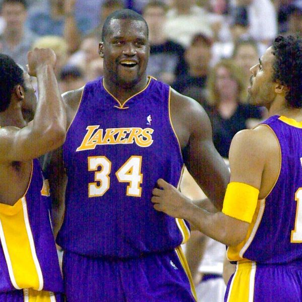 FILE -- In this May 11, 2001 file photo, Los Angeles Lakers' Shaquille O'Neal, center, Kobe Bryant, left, and Rick Fox celebrate a play late in the second half of game three of the Western Conference semifinals against the Sacramento Kings at Arco Arena in Sacramento. Renamed Sleep Train Arena, the facility has been the home of the Kings since it opened in 1988. The Kings won an NBA-best 61 games in the 2001-02 season behind Chris Webber and Vlade Divac, losing to the eventual champion Lakers in Game 7 of the conference finals. The Kings will play their last game at the aging building, Saturday against the Oklahoma City Thunder and begin play next season at the new Golden One Center built in downtown Sacramento. (AP Photo/Mark J. Terrill, file)