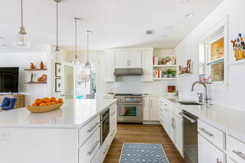 Large, minimalist white kitchen