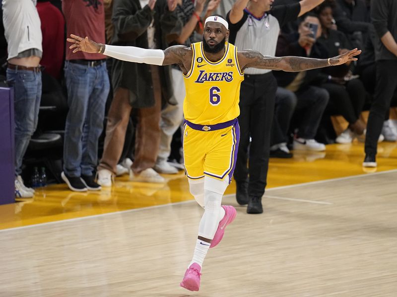 LeBron James celebrates celebrates after scoring to become the NBA's all-time leading scorer