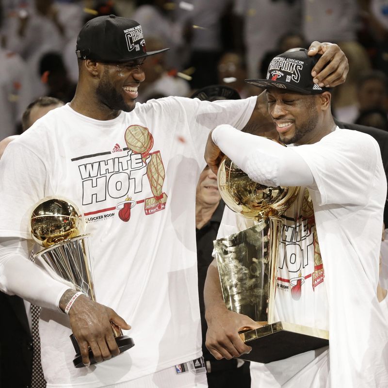 LeBron James holds Bill Russell NBA Finals Most Valuable Player Award