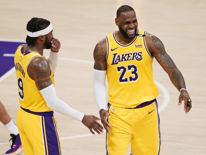 LeBron James smiles with Lakers guard Wesley Matthews