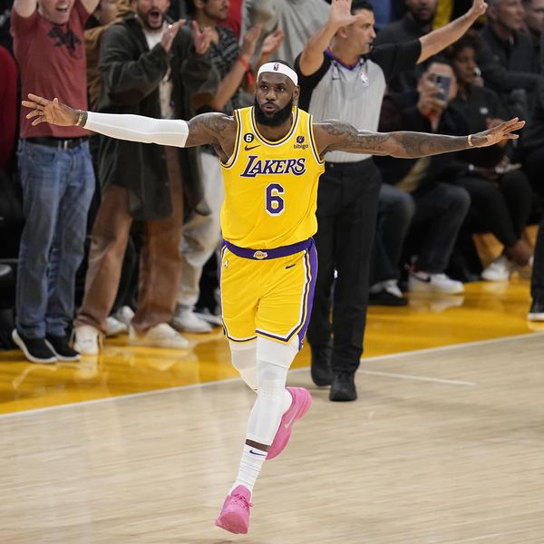 Los Angeles Lakers forward LeBron James celebrates after scoring to pass Kareem Abdul-Jabbar to become the NBA's all-time leading scorer during the second half of an NBA basketball game against the Oklahoma City Thunder Tuesday, Feb. 7, 2023, in Los Angeles. (AP Photo/Mark J. Terrill)
