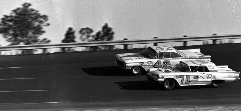 Lee Petty drives against Johnny Beauchamp over Daytona International Speedway