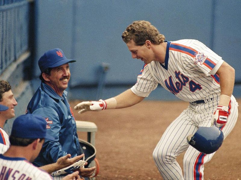 Lenny Dykstra celebrating with New York Mets manager Davey Johnson and teammates