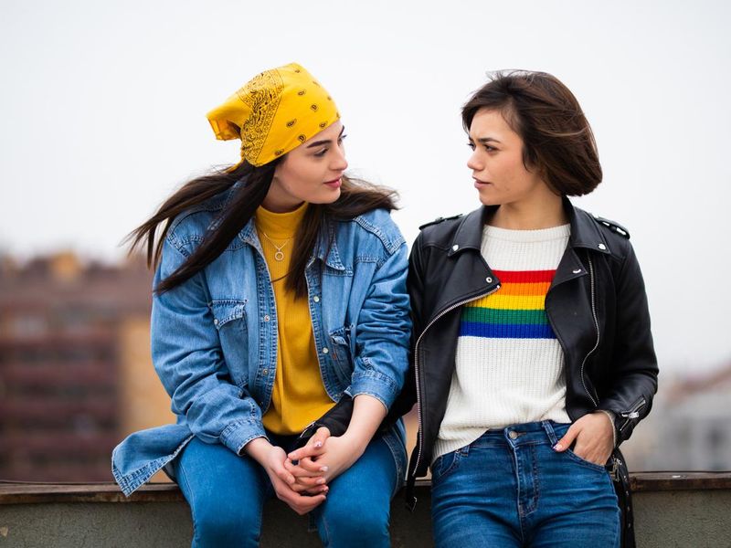 Lesbian couple having discussion on rooftop