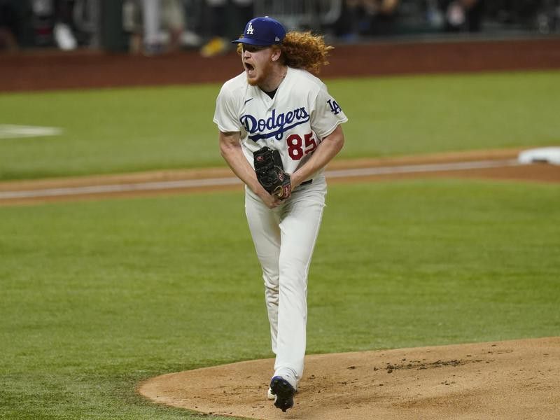 Los Angeles Dodgers starting pitcher Dustin May reacts