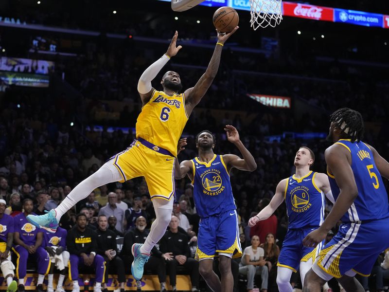 Los Angeles Lakers forward LeBron James scores against the Golden State Warriors