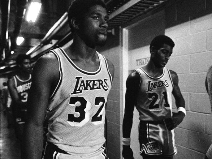 Magic Johnson walking to the the Los Angeles Lakers locker room