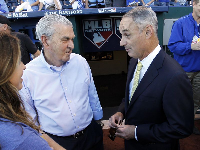 Major League Baseball Commissioner Rob Manfred talks with Kansas City Royals owner David Glass