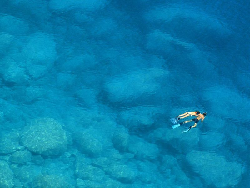 Man and Woman Snorkelling in Greece