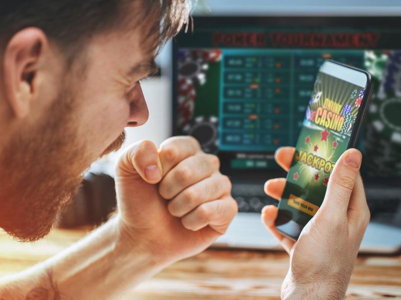 Man celebrating victory after winning in an online casino