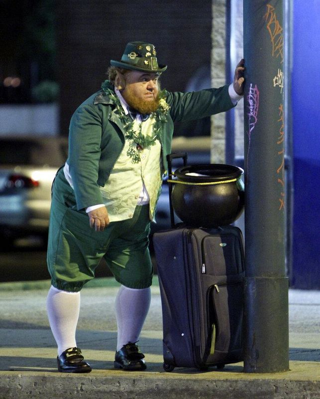 Man dressed as leprechaun waits for bus in Philadelphia