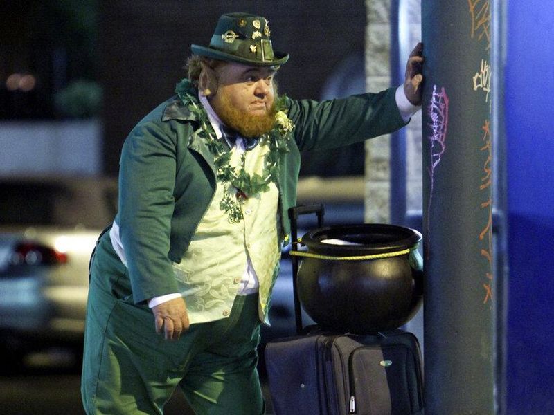 Man dressed as leprechaun waits for bus in Philadelphia