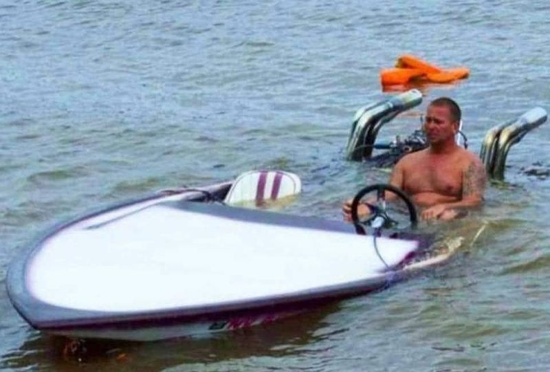 Man driving a sinking boat