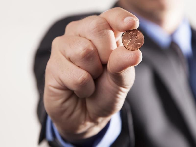 Man holding a penny