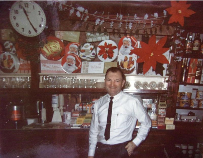 Man in front of store decorations