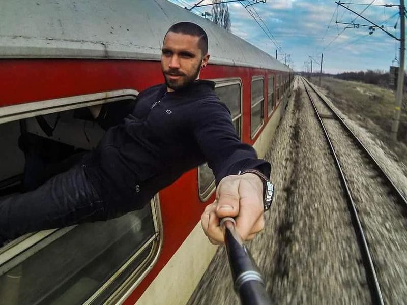 Man taking train selfie