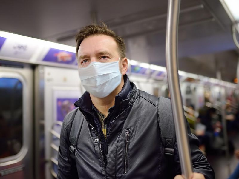 Man wearing mask on subway