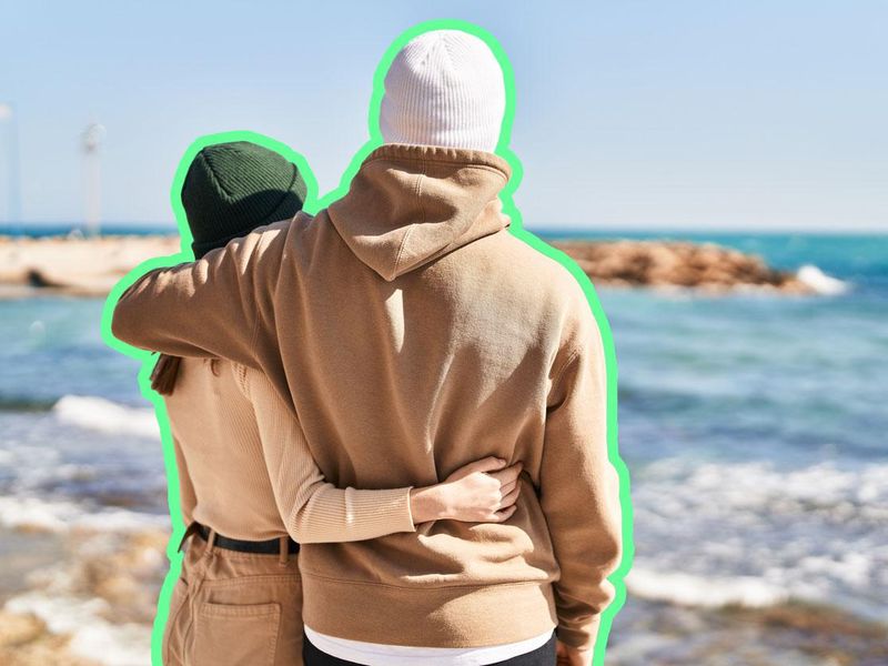 Mand and woman couple hugging each other at seaside