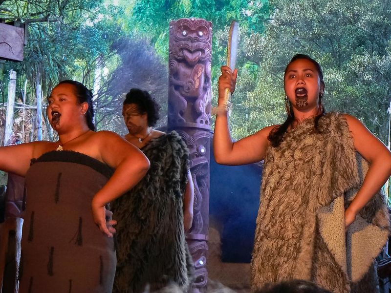 Maori women dancing haka at Mitai Cultural Experience, Rotorua, New Zealand