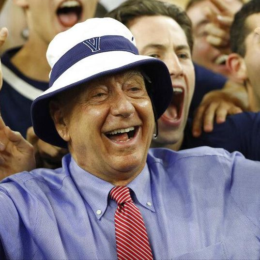 Sportscaster Dick Vitale poses with Villanova fans before the NCAA Final Four tournament college basketball championship game between Villanova and North Carolina, Monday, April 4, 2016, in Houston. (AP Photo/Eric Gay)