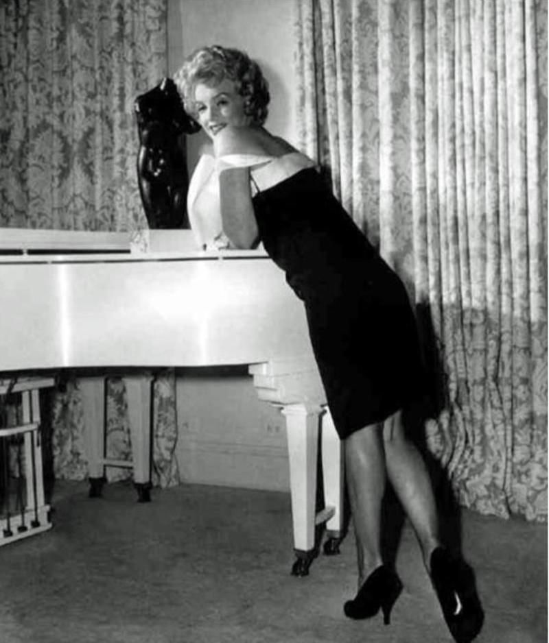 Marilyn Monroe at her Baby Grand Piano