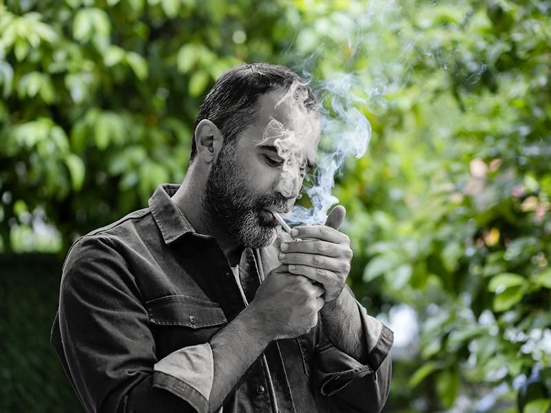 Mature man smoking portrait