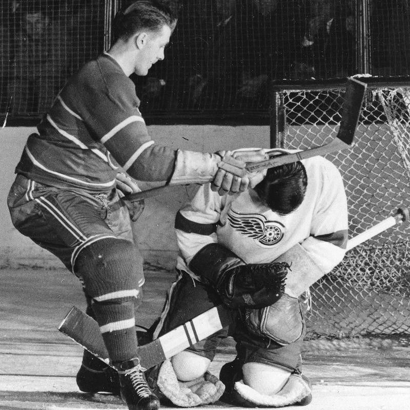 Maurice "Rocket" Richard hits Detroit Red Wings goalie Terry Sawchuk in the head with his stick