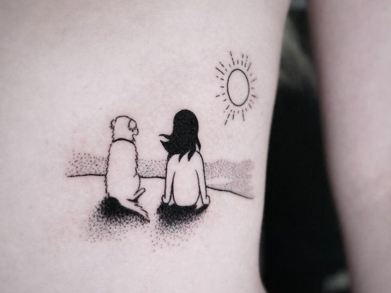 Meaningful tattoo of girl and dog