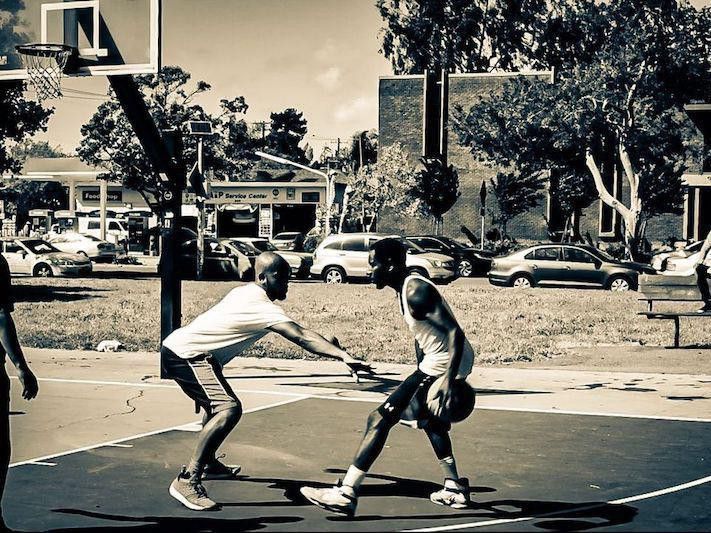 Men playing at Mosswood Park Basketball Courts