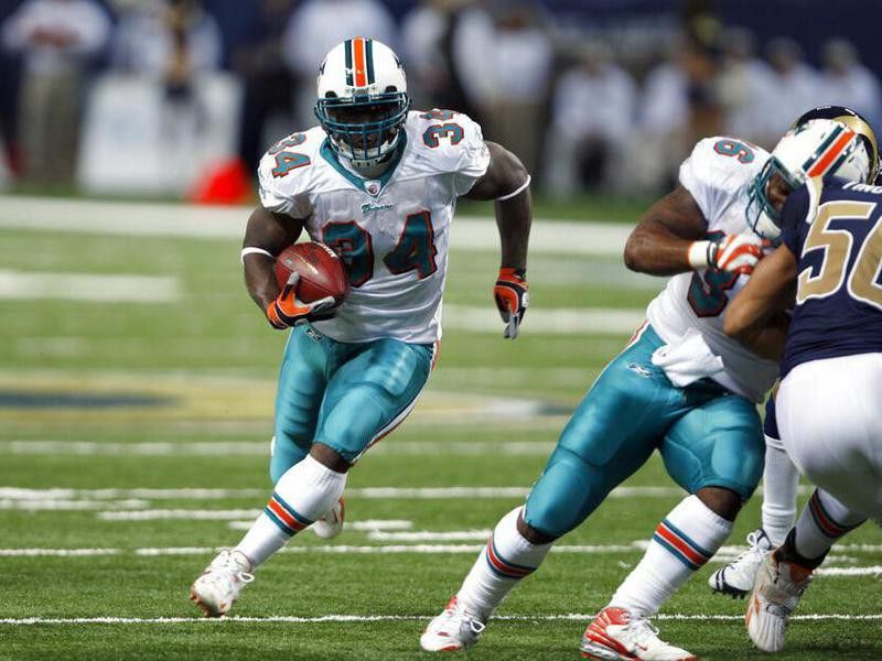 Miami Dolphins running back Ricky Williams runs with ball