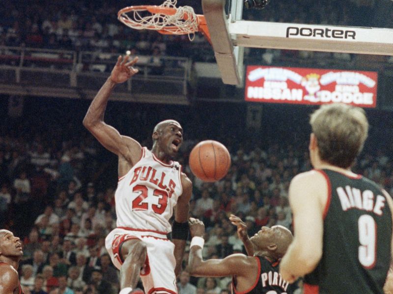 Michael Jordan slams the ball