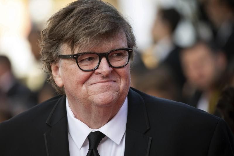 Michael Moore poses at film festival at Cannes