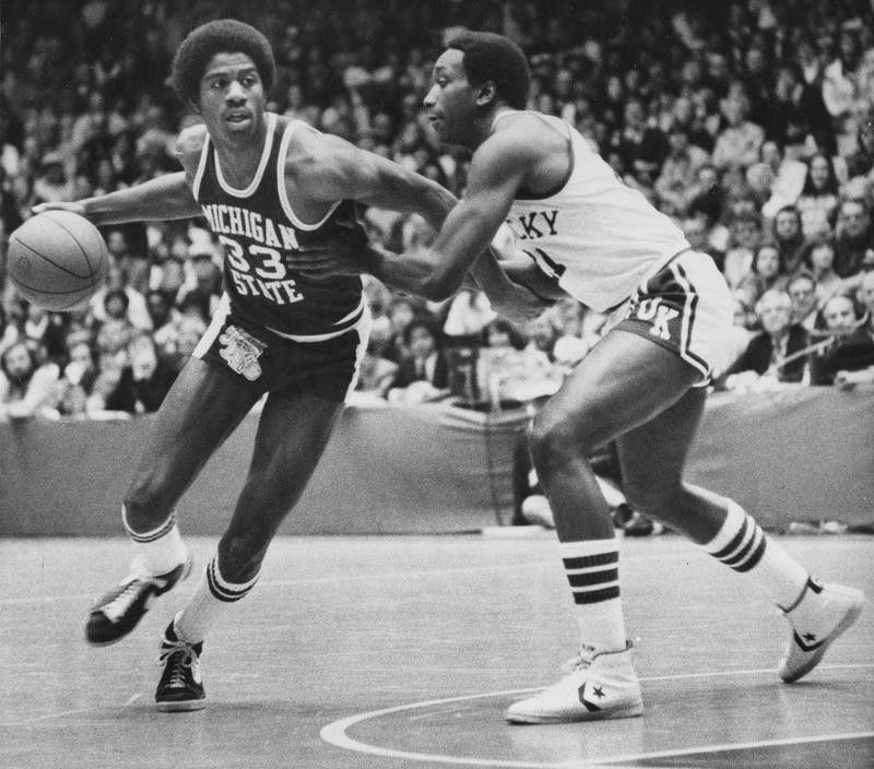 Michigan State forward Earvin Johnson pushes off Kentucky forward Jack Givens