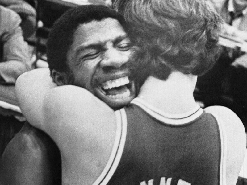 Michigan State's Earvin "Magic" Johnson hugs Terry Donnelly after the Spartans beat Notre Dame