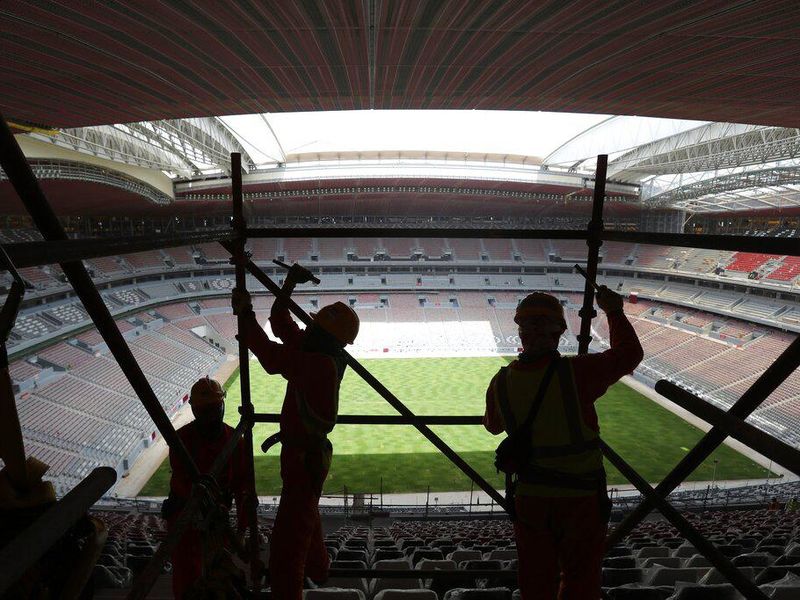 Migrant workers in Qatar building a World Cup stadium