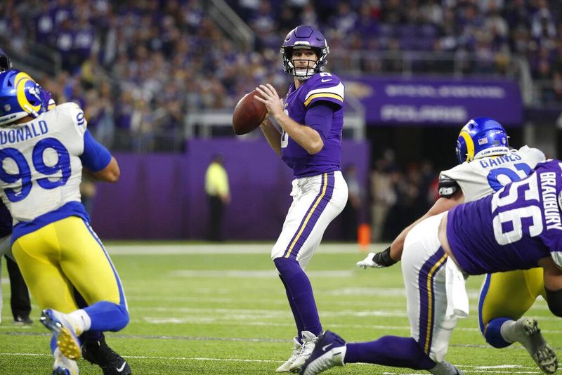 Minnesota Vikings quarterback Kirk Cousins looks to throw