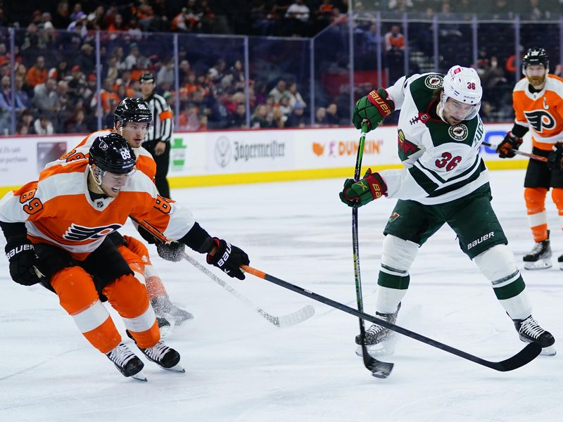Minnesota Wild's Mats Zuccarello passes puck against Philadelphia Flyers' Cam Atkinson