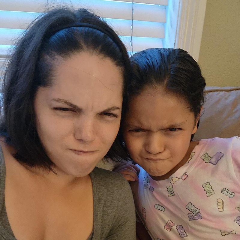 Mom and daughter making silly faces together