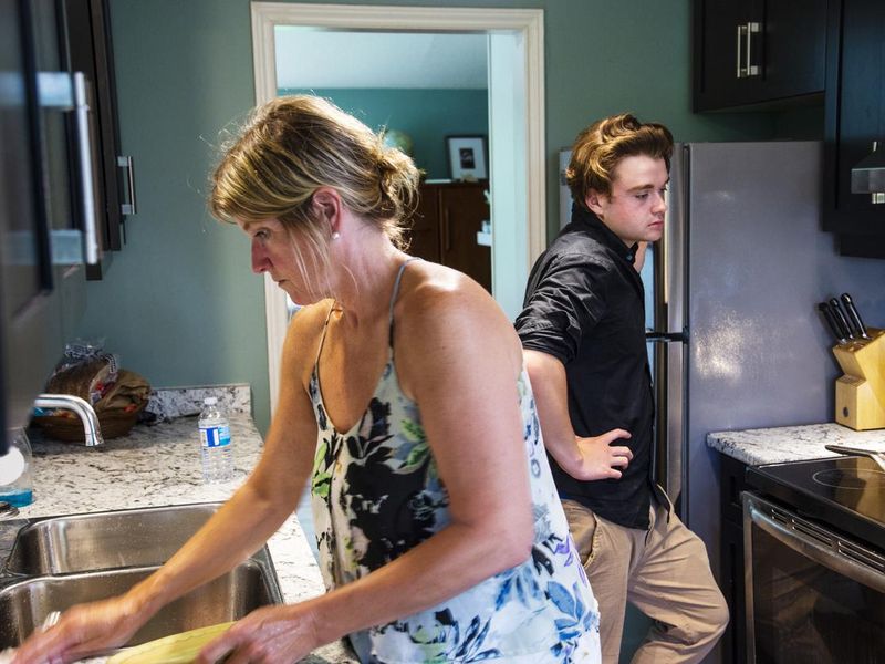 Mother and son in their kitchen