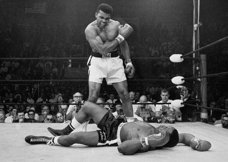 Muhammad Ali reacts after he defeats Sonny Liston