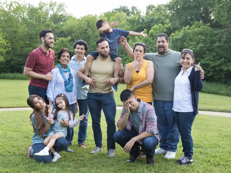 Multi-generational family take funny group photo