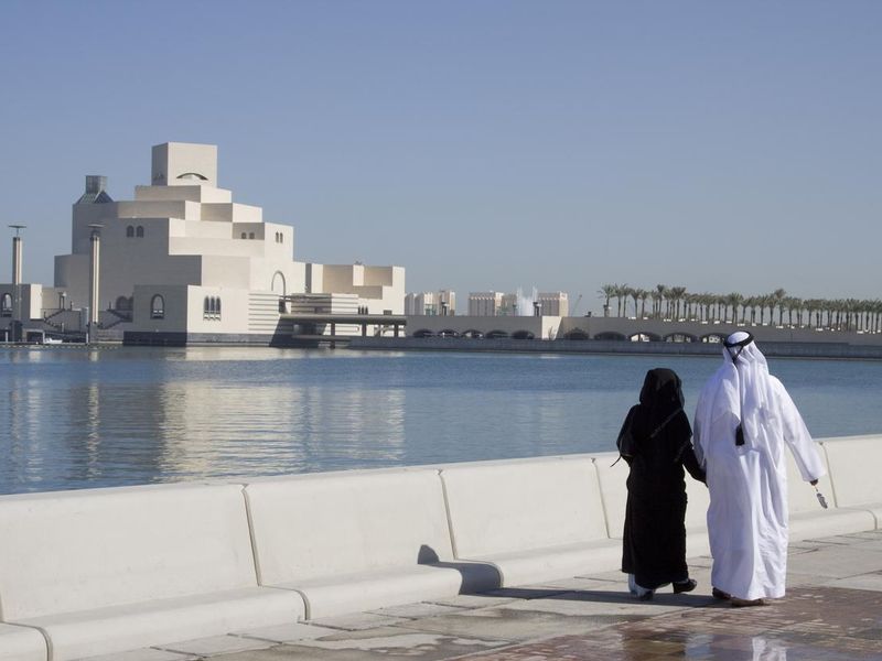 Muslim couple along Doha Corniche