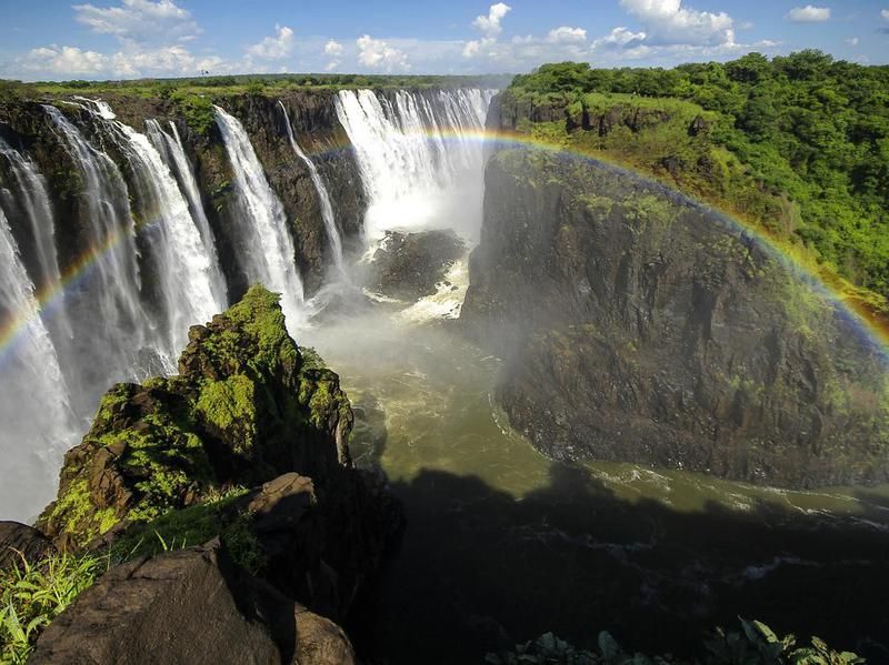Natural Wonder: Rainbow over a view of Victoria Falls