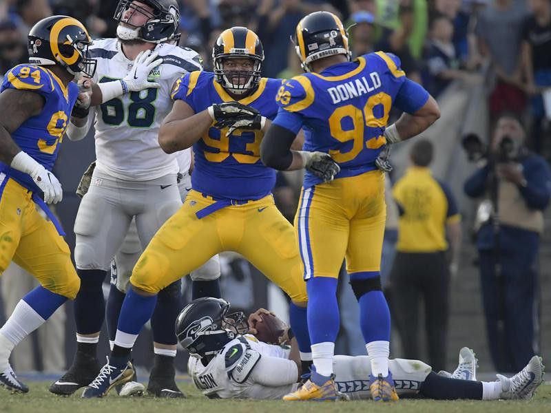 Ndamukong Suh celebrates after sacking Russell Wilson of the Seattle Seahawks
