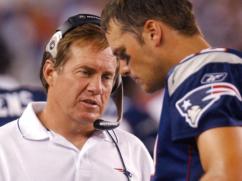 New England Patriots coach Bill Belichick, left, talks with quarterback Tom Brady