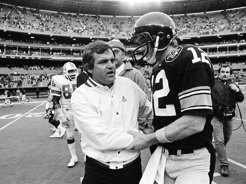 New England Patriots coach Ron Meyer congratulates Steelers quarterback Terry Bradshaw