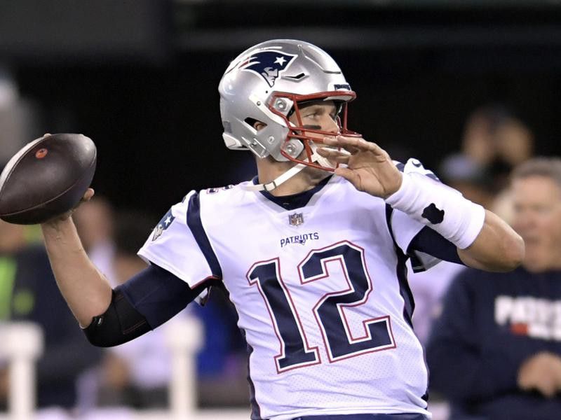 New England Patriots quarterback Tom Brady throwing