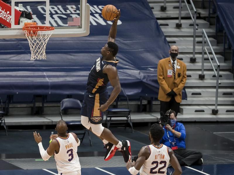 New Orleans Pelicans forward Zion Williamson dunks past Phoenix Suns